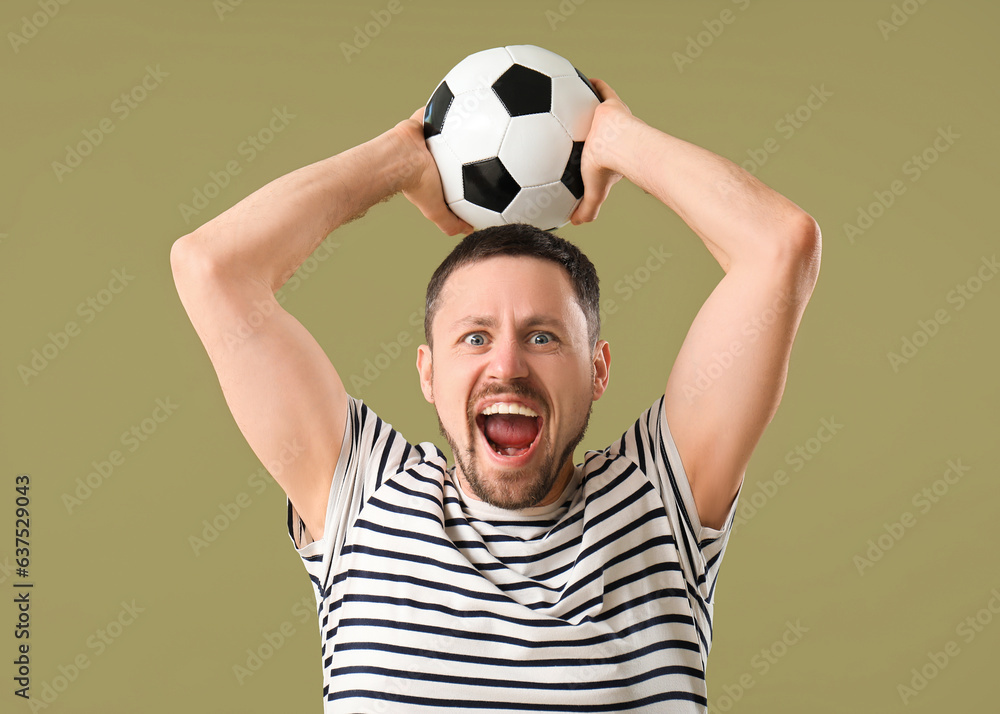 Screaming man with soccer ball on color background