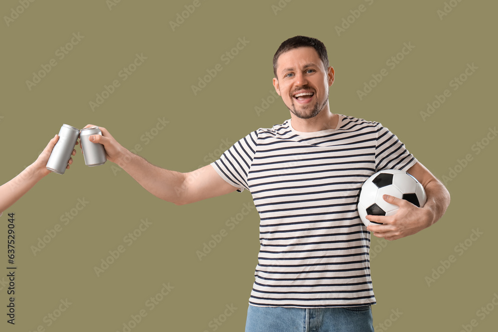 Man with soccer ball and beer on color background