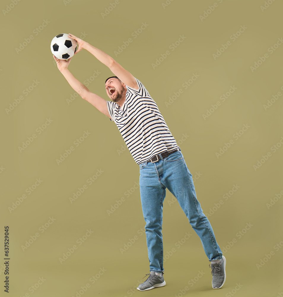 Man playing with soccer ball on color background