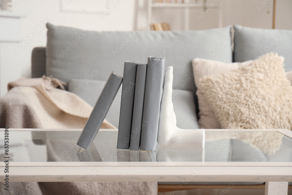 Stylish holder for books on coffee table in living room