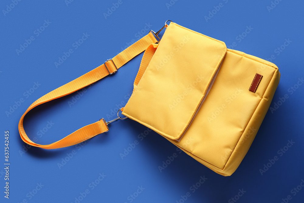 Yellow lunch box bag on blue background