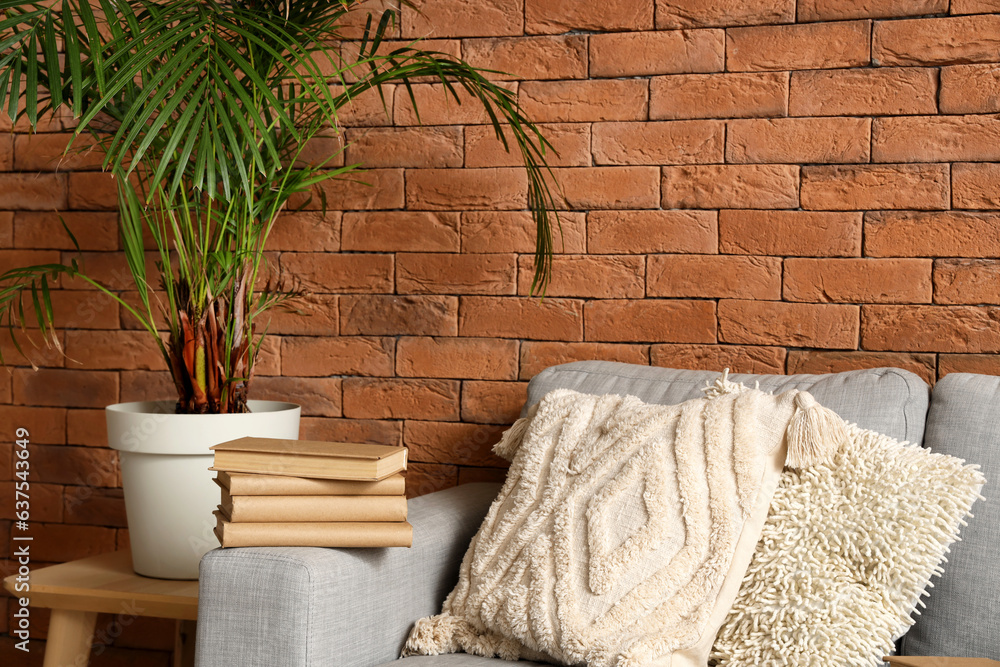 Stack of books on sofa in living room