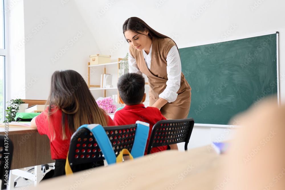 Female teacher conducting lesson in classroom