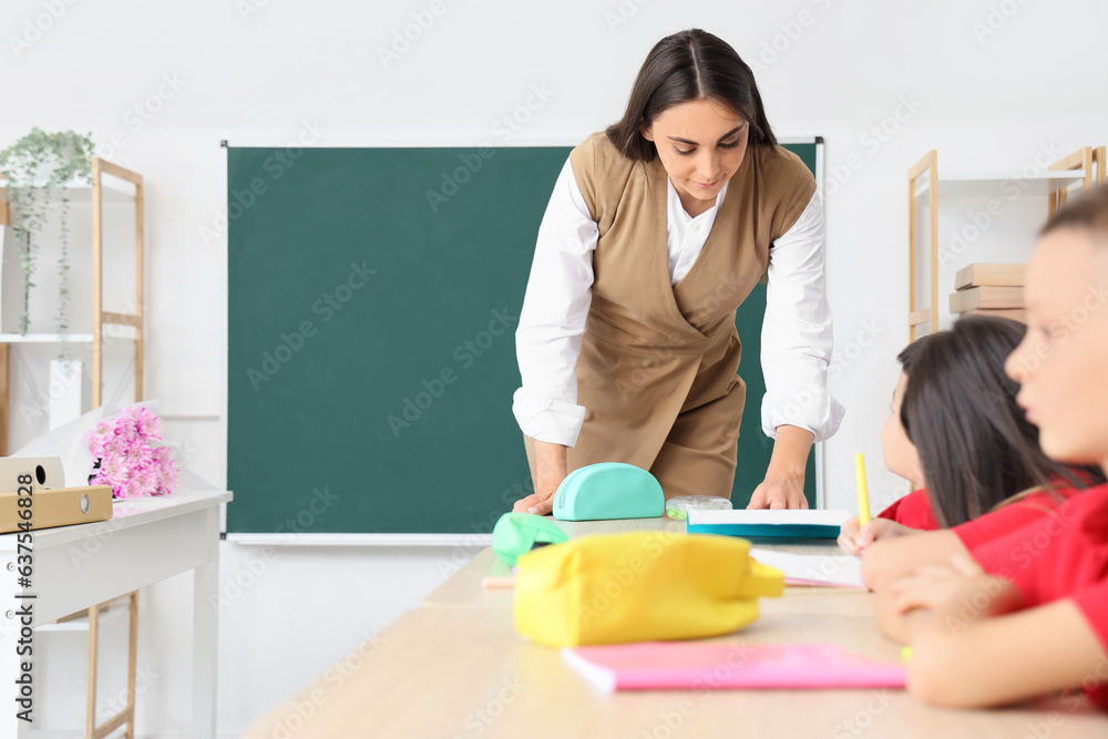 Female teacher conducting lesson in classroom