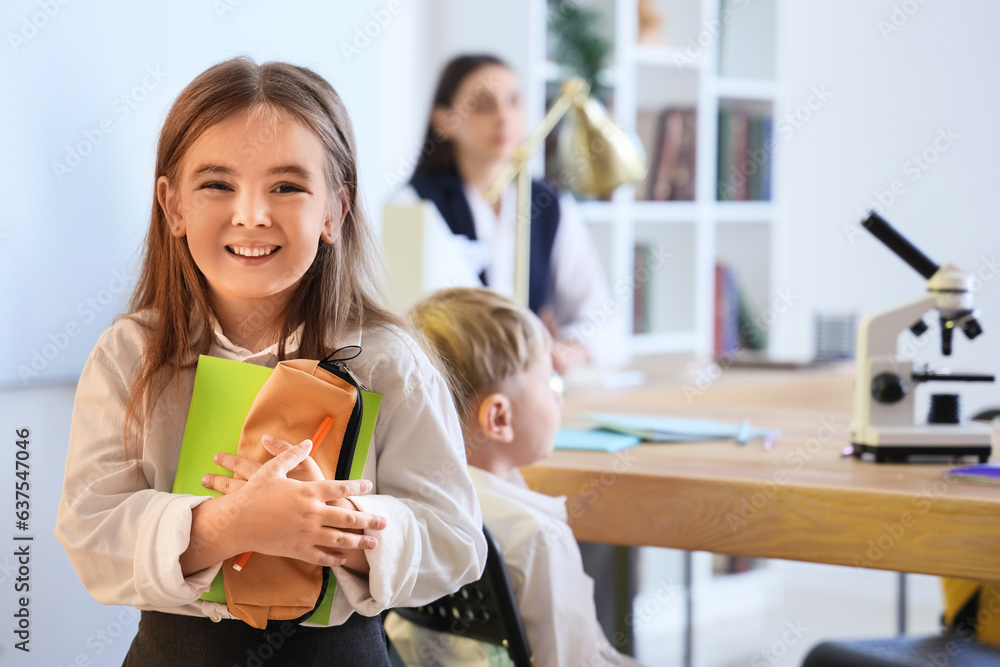 Little girl in classroom at school