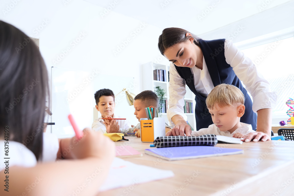 Female teacher conducting lesson in classroom