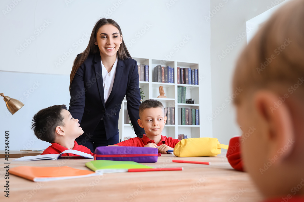 Female teacher conducting lesson in classroom