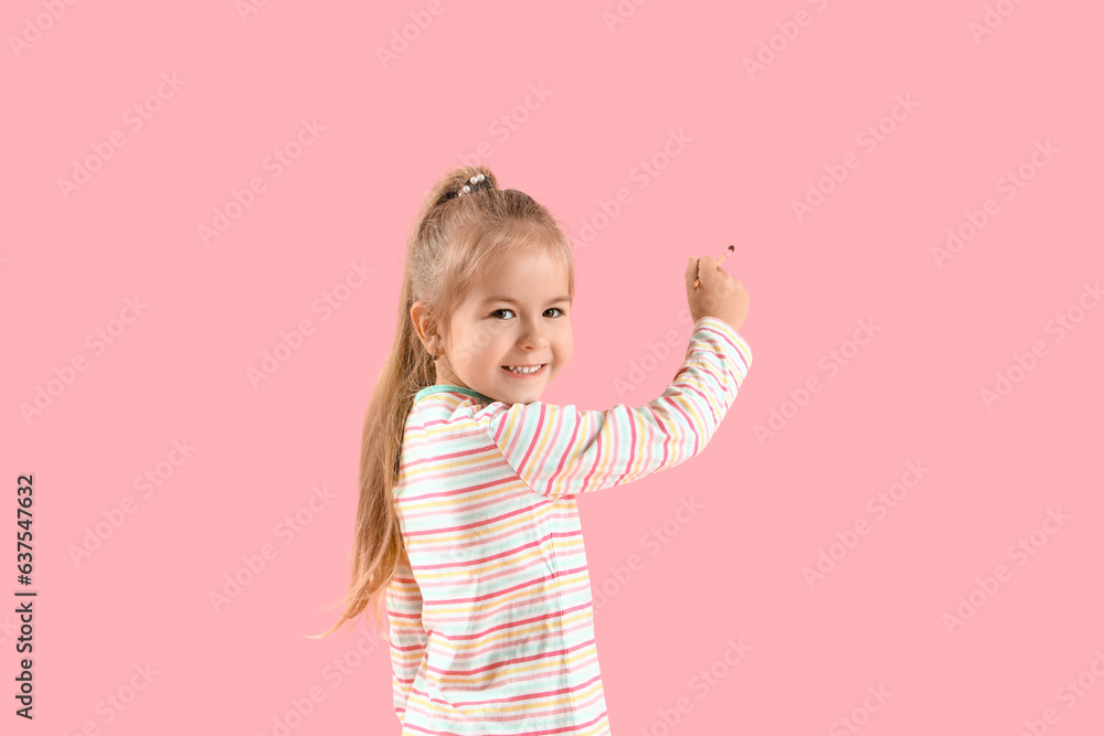 Cute little girl with paint brush on pink background