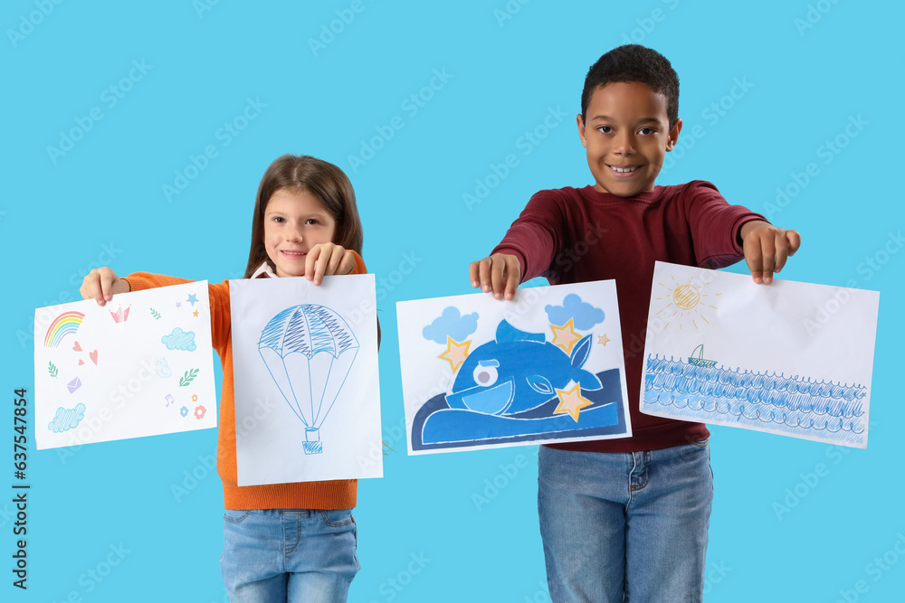 Cute little children with drawings on blue background