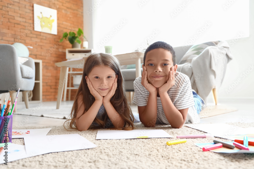 Cute little children drawing at home