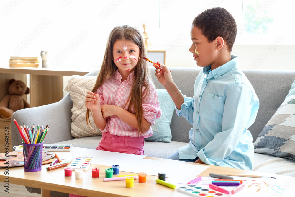 Cute little children drawing at home