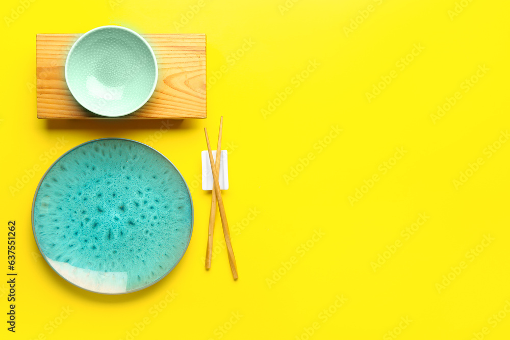 Chinese table setting on yellow background