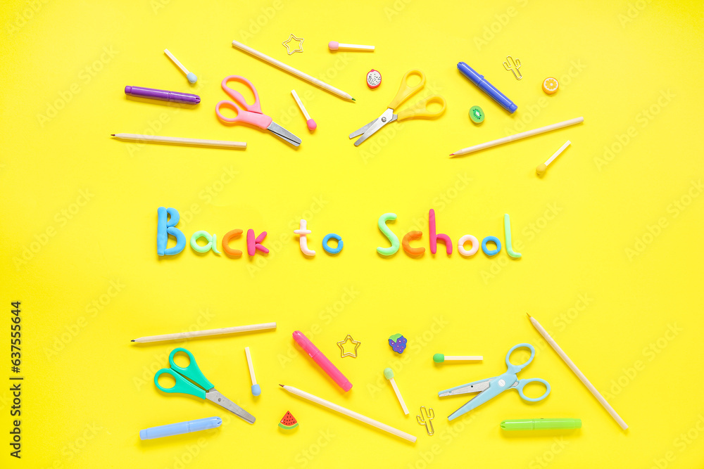 Text BACK TO SCHOOL and stationery on yellow background