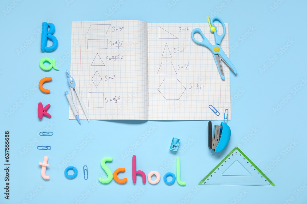 Text BACK TO SCHOOL and stationery on light blue background