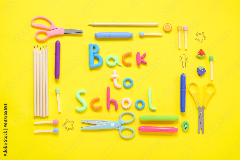 Text BACK TO SCHOOL and stationery on yellow background