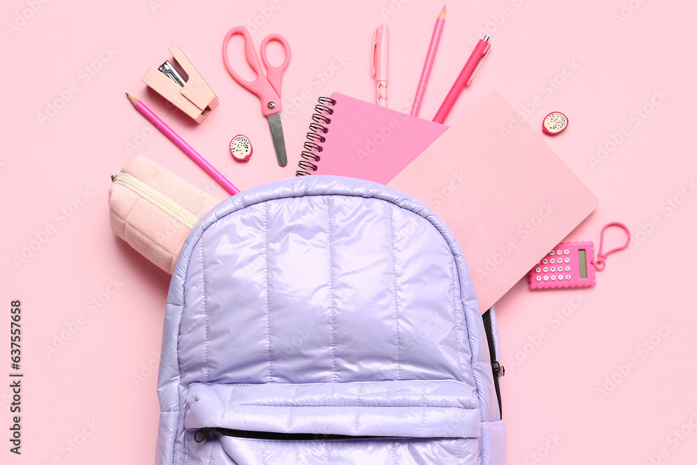 Stylish school backpack with different stationery supplies on pink background