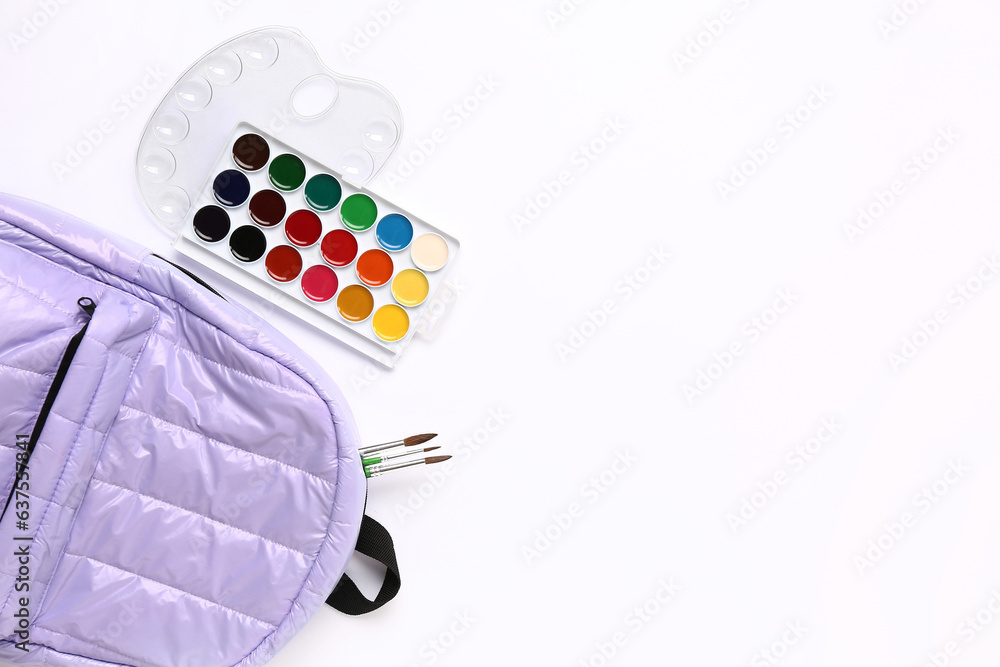 Stylish school backpack with different stationery supplies on white background