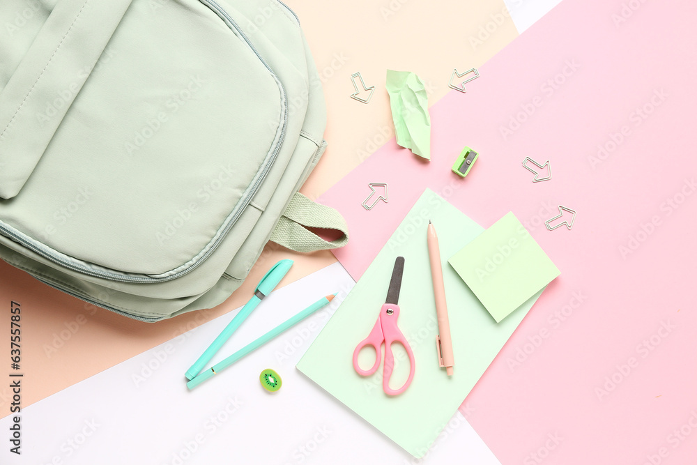 Stylish school backpack with different stationery supplies on colorful background