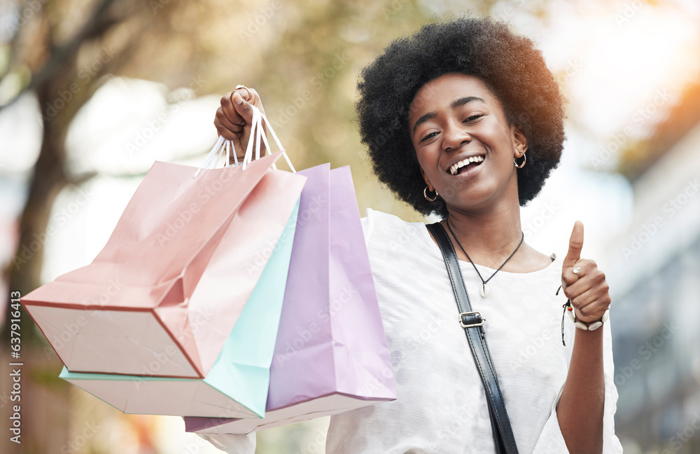 Woman, shopping bag and thumbs up in city for success, thank you and support, like or yes emoji. Hap