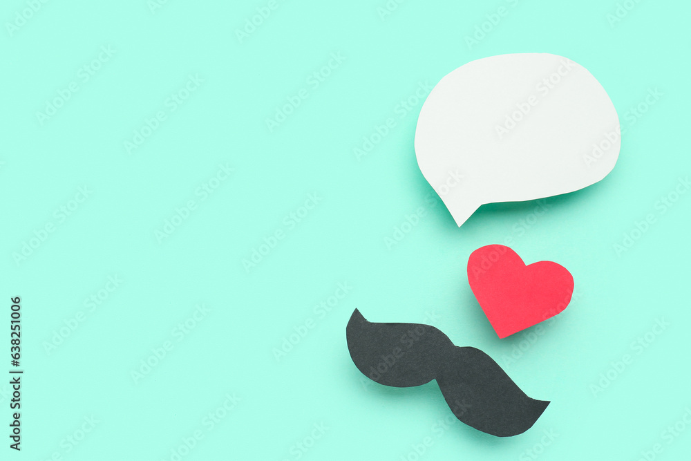 Paper mustache and heart with blank speech bubble on turquoise background