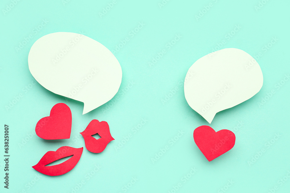 Paper lips and hearts with blank speech bubbles on turquoise background