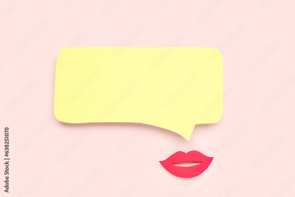 Paper lips with blank speech bubble on pink background