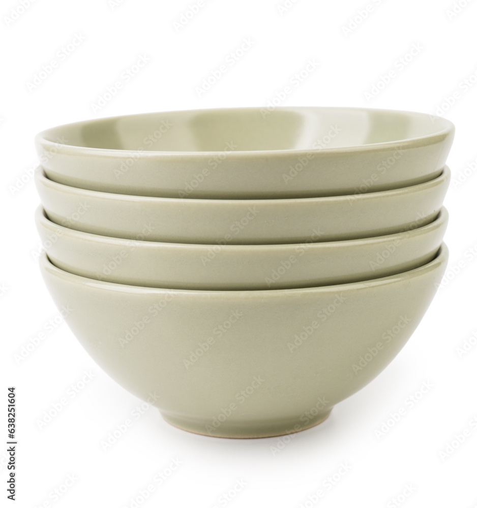 Set of light green bowls on white background