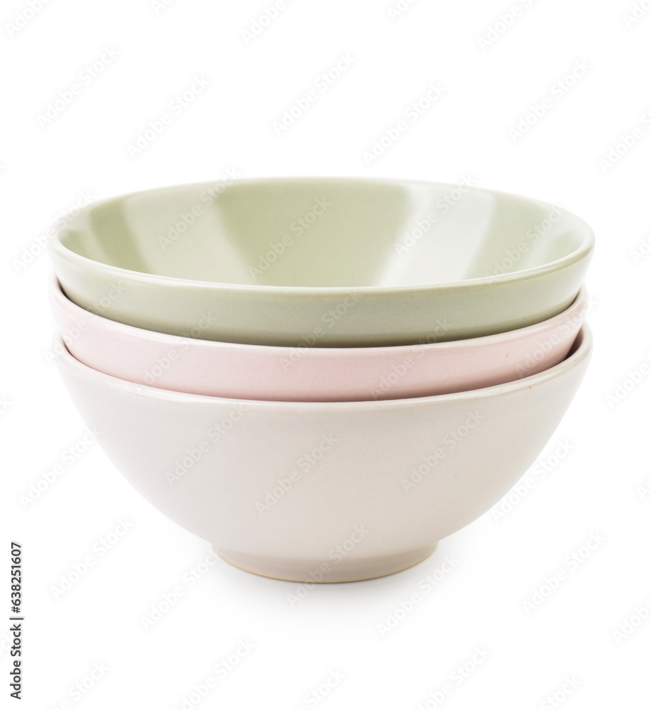 Set of color bowls on white background