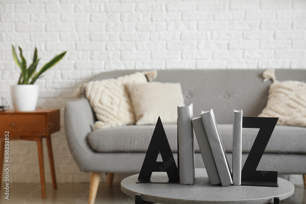 Stylish holder for books on coffee table in living room