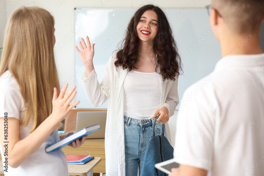 Female student with her classmates in classroom