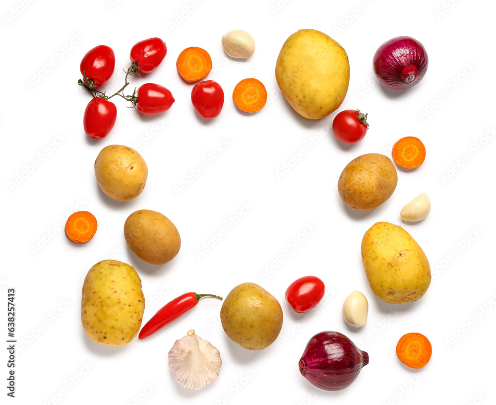 Frame made of potatoes, tomatoes and garlic on white background