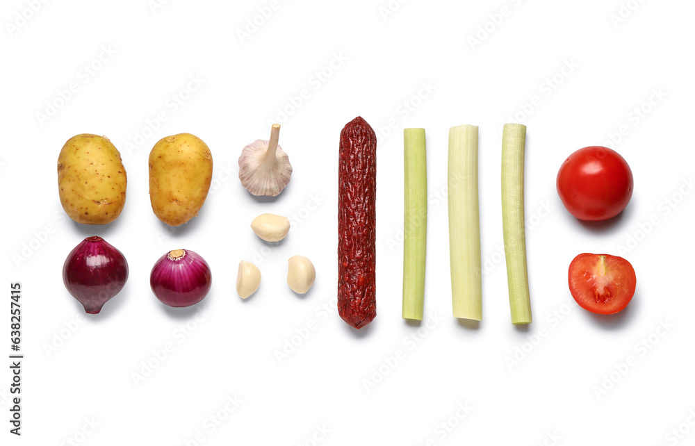 Composition with salami and fresh vegetables on white background