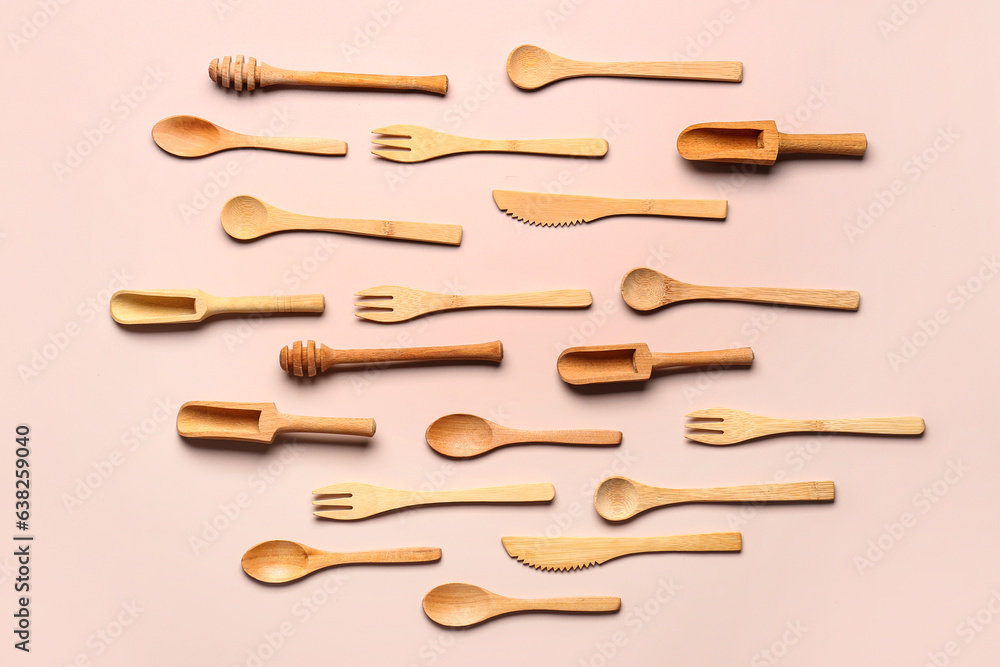 Wooden kitchen utensils on beige background