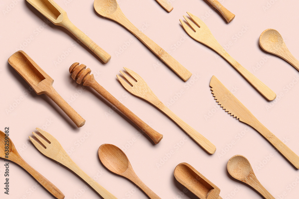 Wooden kitchen utensils on beige background