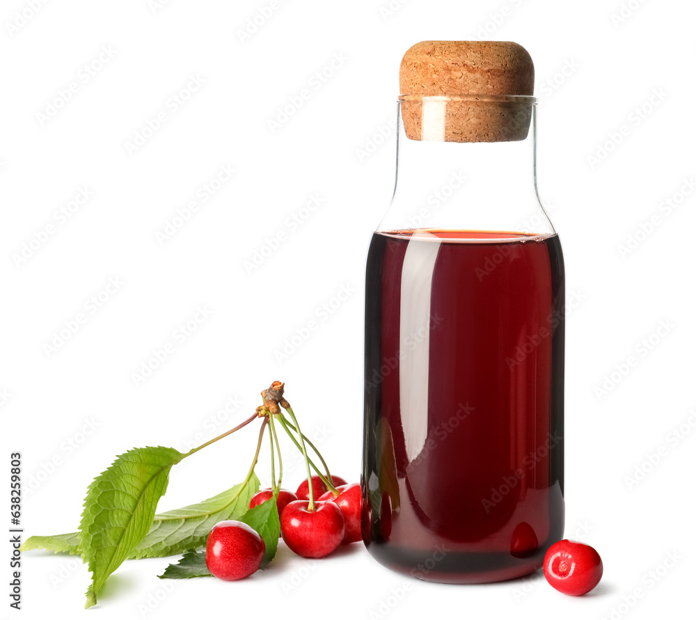 Bottle of sweet cherry liqueur with fresh berries on white background