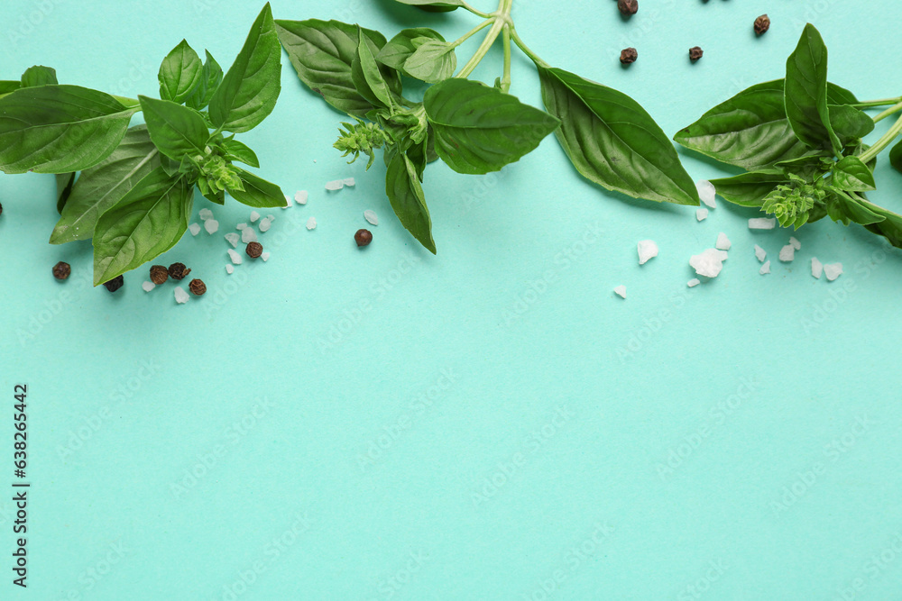 Composition with fresh basil and spices on color background