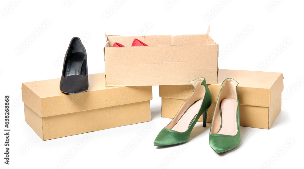 Cardboard boxes with stylish female shoes on white background