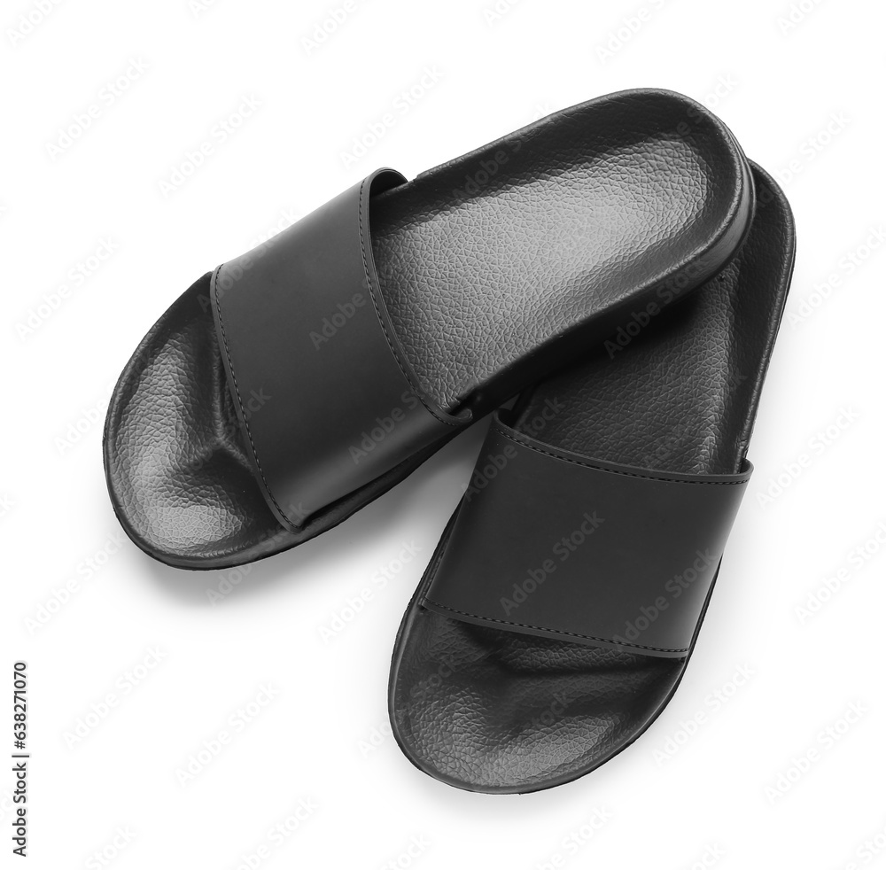 Black female flip flops on white background