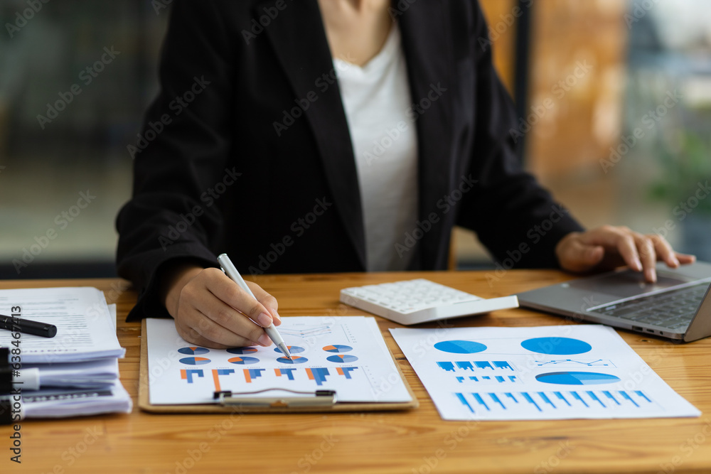 Businesswoman working on paperwork, Analysis of financial report documents and investment charts on 