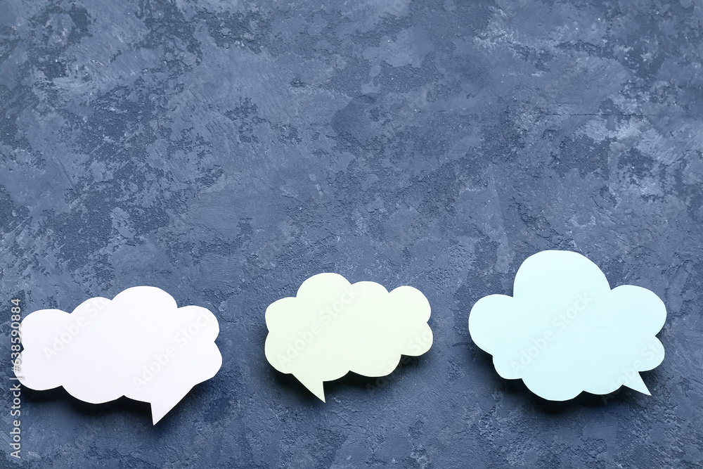 Blank speech bubbles on dark blue background