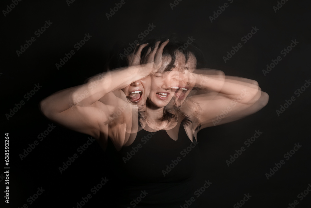 Stroboscopic photo of shouting young woman on dark background