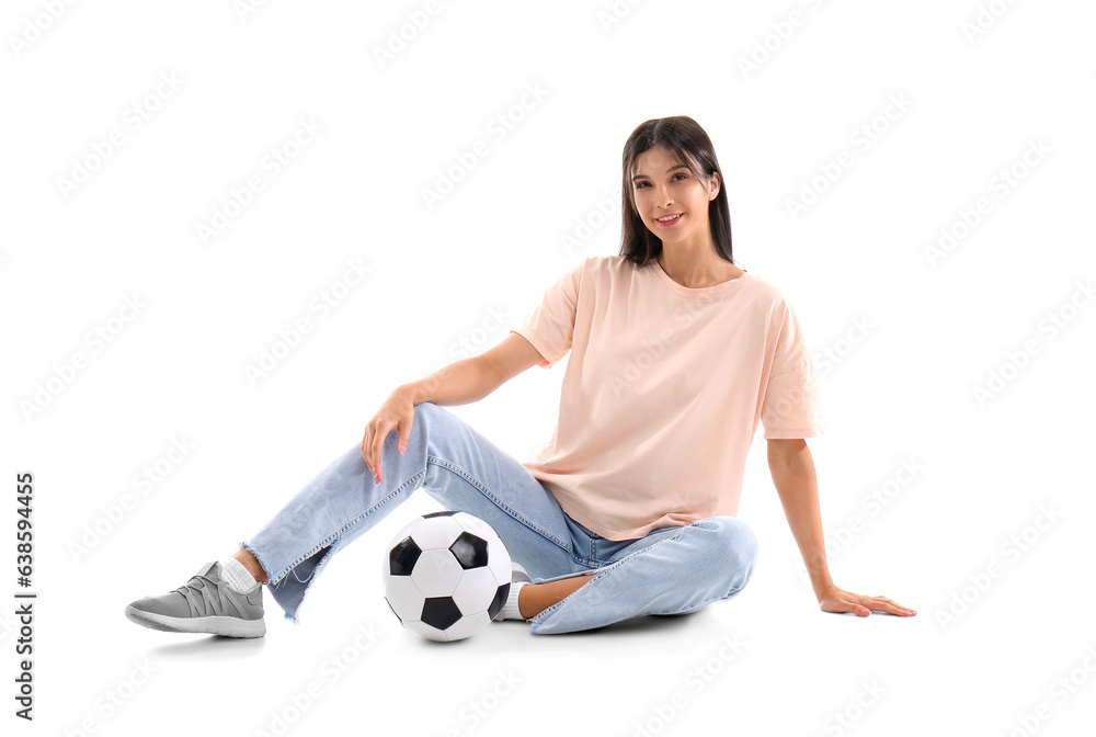 Young woman with soccer ball on white background