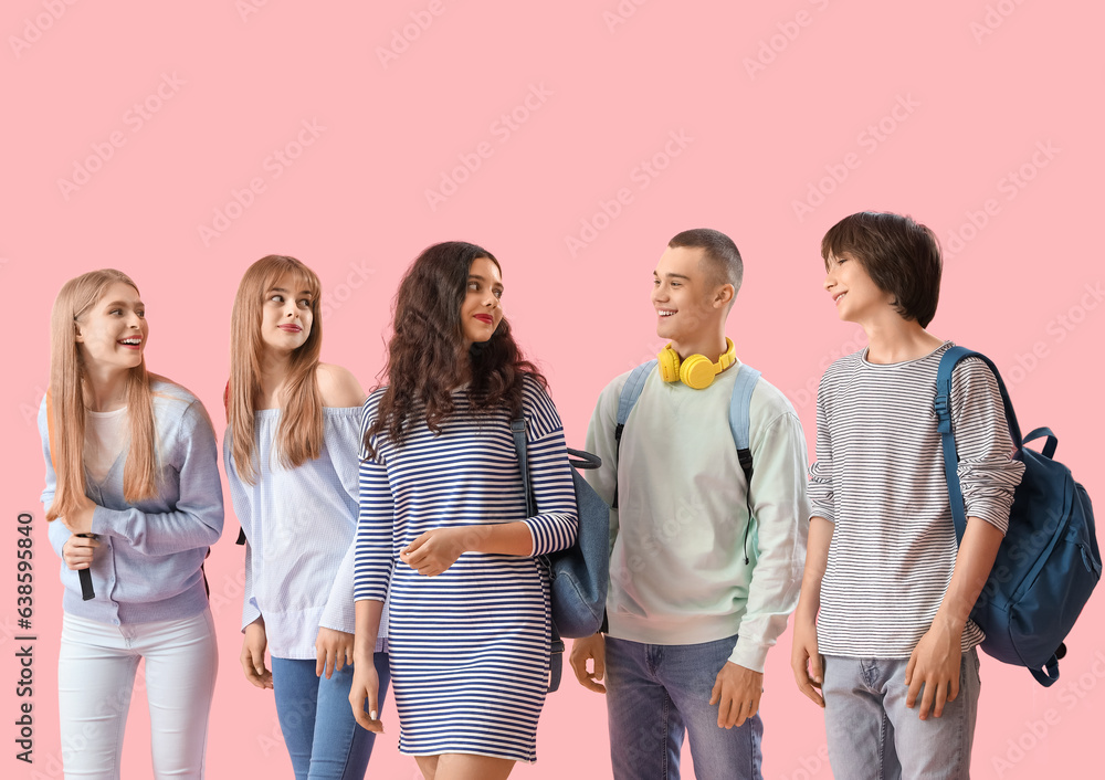 Group of students on pink background