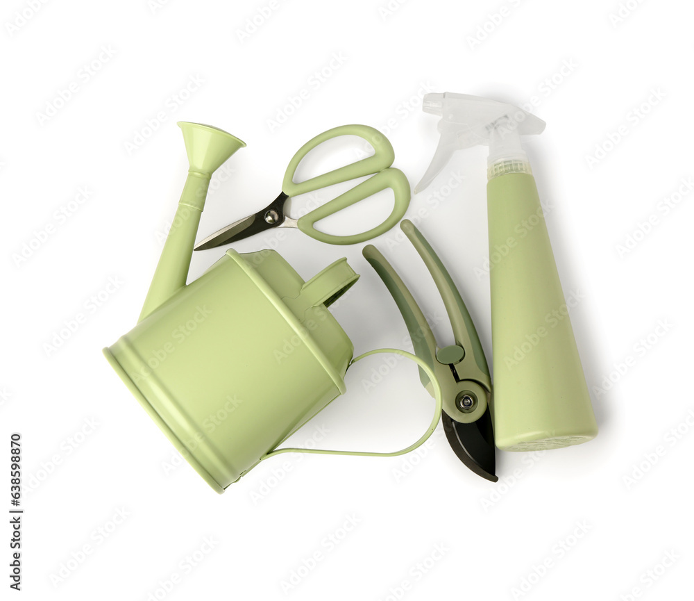 Watering can with atomizer, floral scissors and secateurs on white background