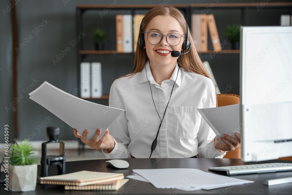 Beautiful consultant of call center working in office