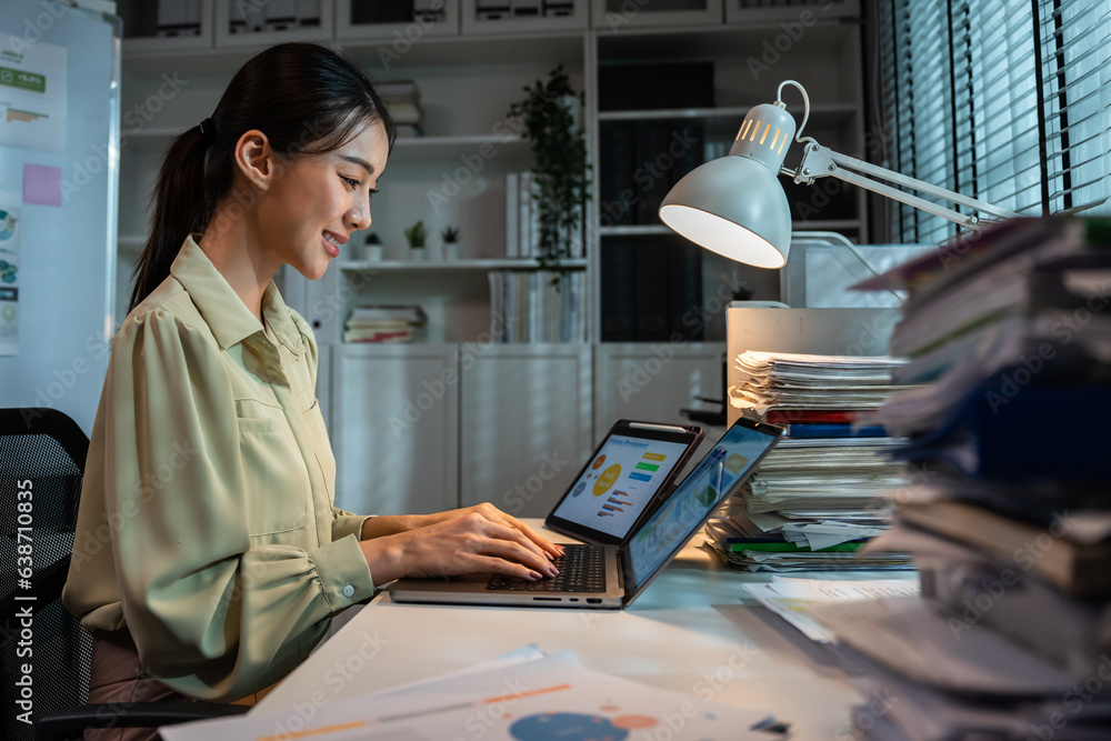 Asian beautiful businesswoman using laptop computer working in office. 