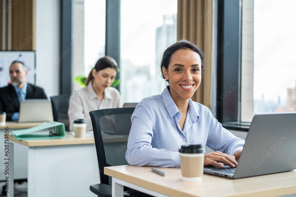 Portrait of Latino beautiful business woman smile while work in office. 