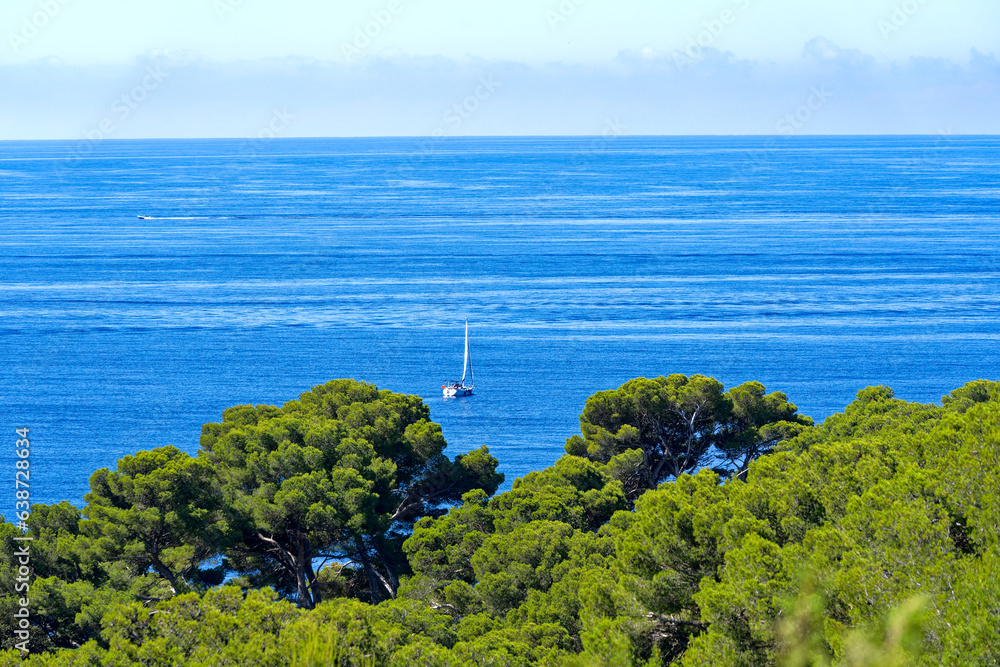 Aerial view of Mediterranean Sea seen from viewpoint of village of Giens with sailing boats in the b