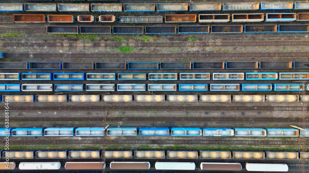 Drone view of freight trains. Colorful railway cargo wagons on railroad. Aerial view of colorful wag