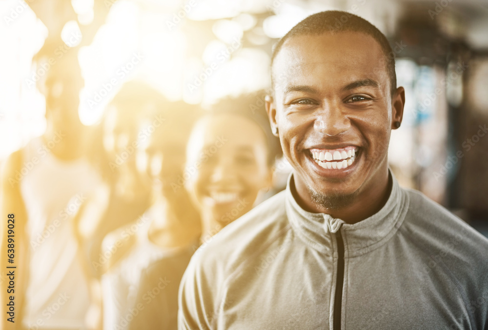 Fitness, black man and portrait with team, workout class and training in a health and wellness club.